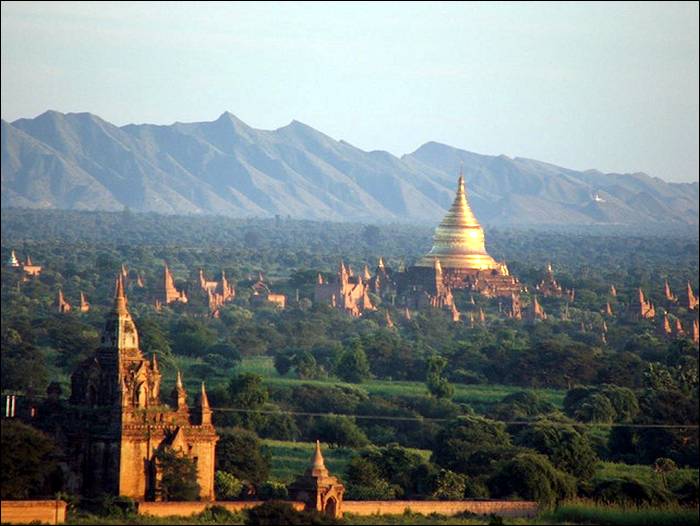 Bagan became a central powerbase in the mid 9th century under King Anawratha, who unified Burma under Theravada Buddhism. Over the course of 250 years, Bagan's rulers and their wealthy subjects constructed over 10,000 religious monuments in the Bagan plains. The prosperous city grew in size and grandeur, and became a cosmopolitan center for religious and secular studies. Monks and scholars from as far as India, Ceylon as well as the Khmer Empire came to Bagan to study prosody, phonology, grammar, astrology, alchemy, medicine, and law.