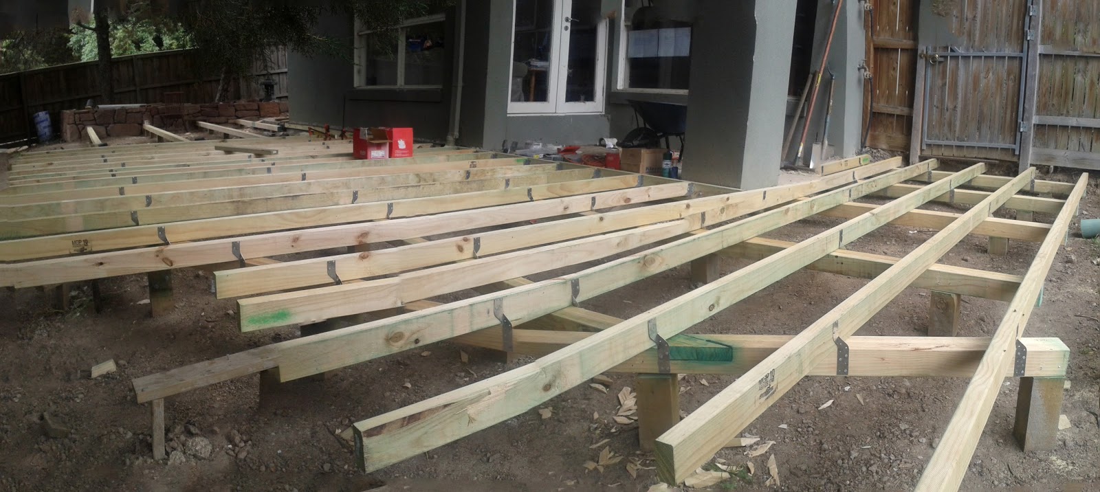 Let's Build a Deck Deck building. Laying in the ledger and joists