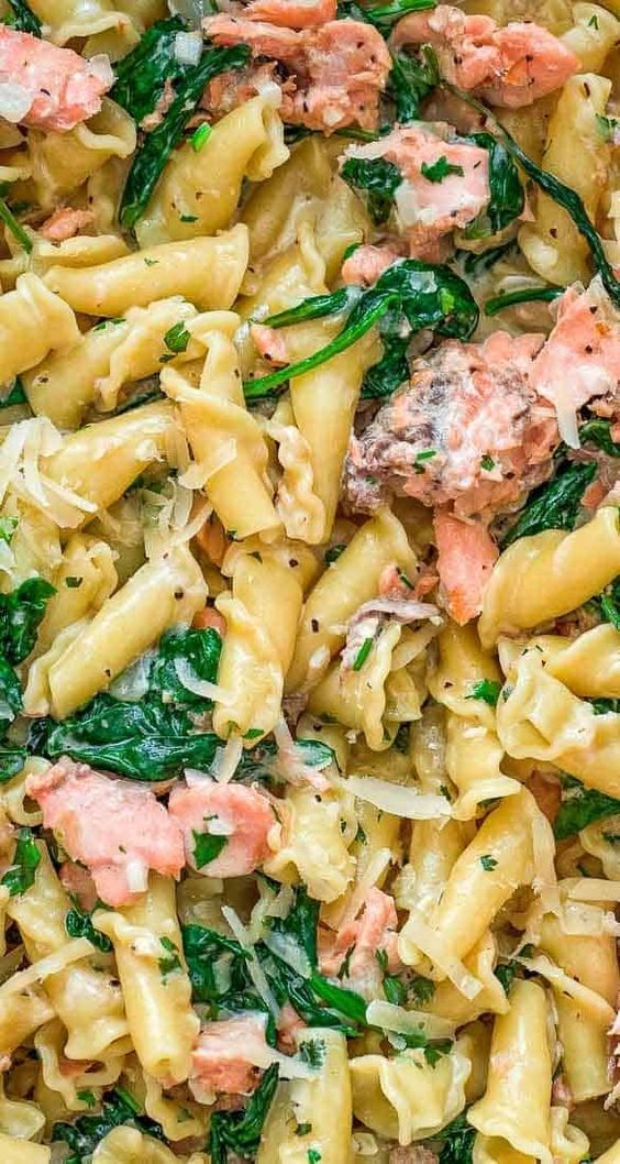 This Salmon Pasta with Spinach is a deliciously easy pasta recipe with chunks of tender salmon and spinach in a scrumptious, creamy Parmesan sauce!