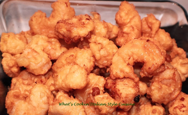 these are tempura deep fried shrimp cooling off in a pan