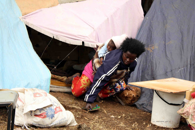 De-Deur refugee camp. Arine Tusenge from Burundi is among refugees that found themselves out in the open again after several they were evicted from a shelter on the Vaal, South Africa.They had been moved to the shelter after 2008's xenophobia related attacks. They fear re-intergration into society and prefer to stay in the open.01-10-09. Photo: Tawedzerwa Zhou 