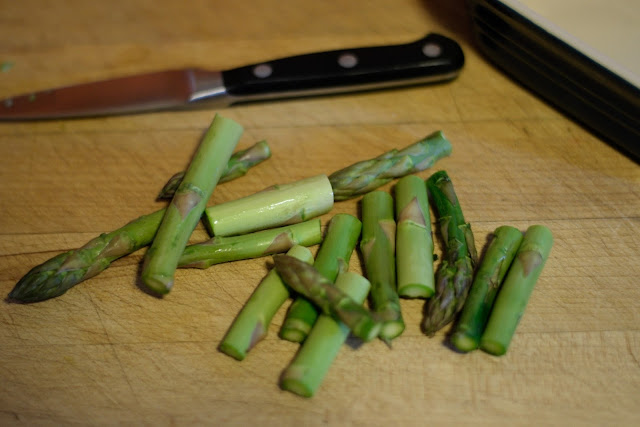 The asparagus cut into bite-sized pieces. 