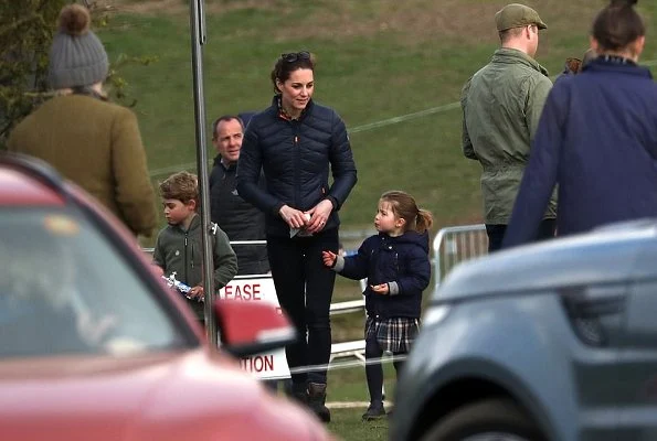 Princess Charlotte. Prince George wore Columbia fleece jacket, Kate Middleton wore Barbour longshore quilted jacket