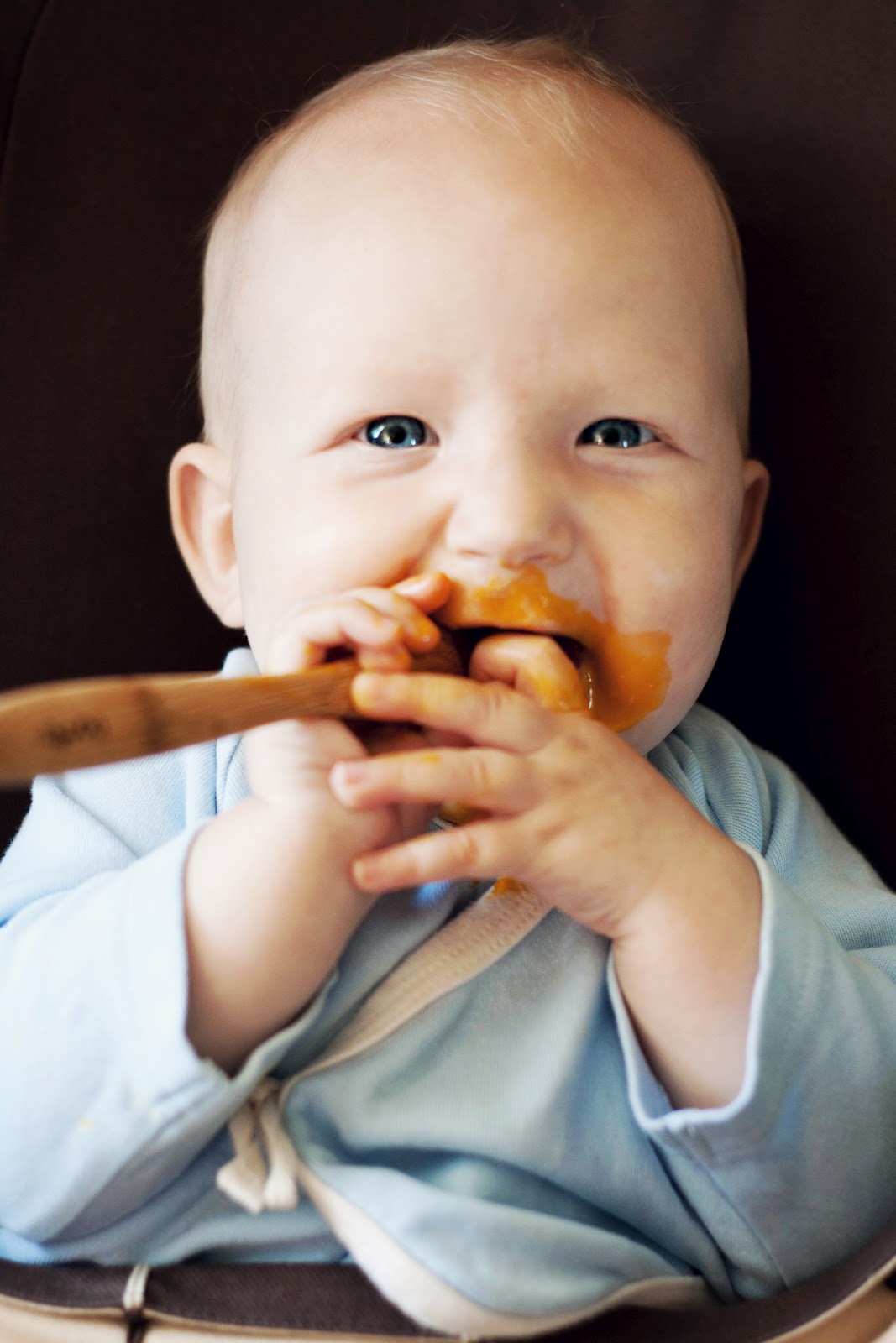 A Simmering Pot and a Mom Feeding Hutcheson Egg Yolk for Baby