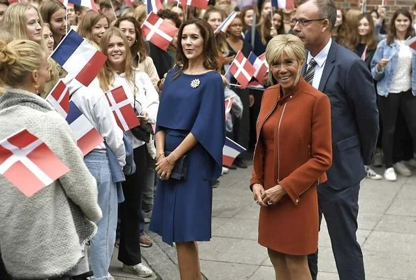 Brigitte Macron wore a dress by Louis Vuitton. Crown Princess Mary wore Stella McCartney cape gown. President Emmanuel Macron