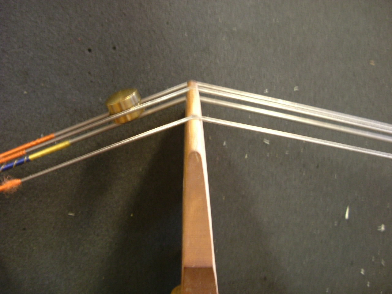 Bass Care Instrument Repair Raising the saddle on a double bass to lessen the string angle.