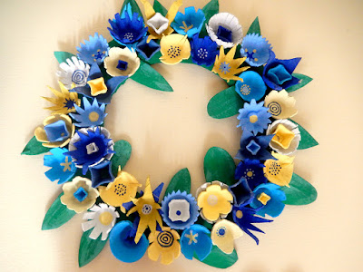 blue and yellow wreath made from egg cartons