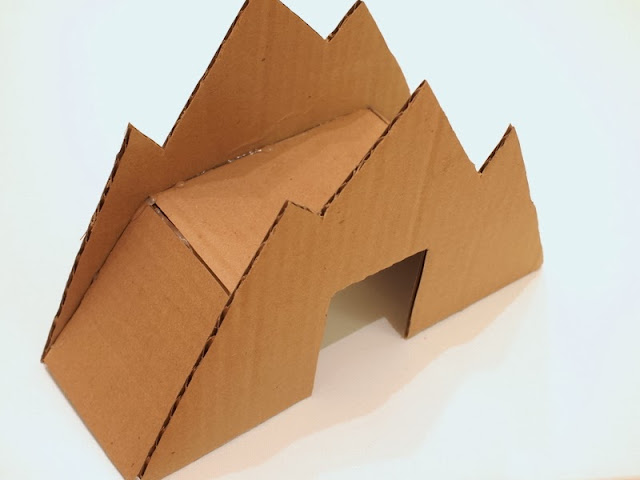 glue your cardboard toy mountain bridge together