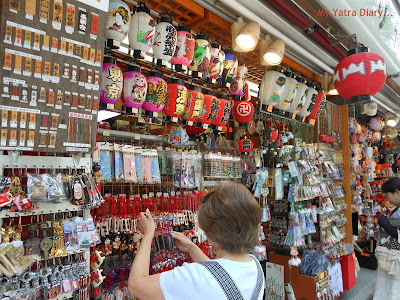 Wall Hangings and other good luck charms on display in Nakamise Shopping arcade, Sensoji temple, Japan