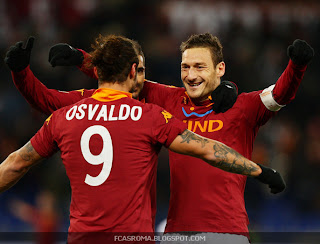 Osvaldo, Totti and Perotta celebrating a goal.