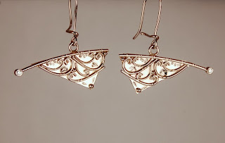 18k white gold pendulum style earrings with diamond accents