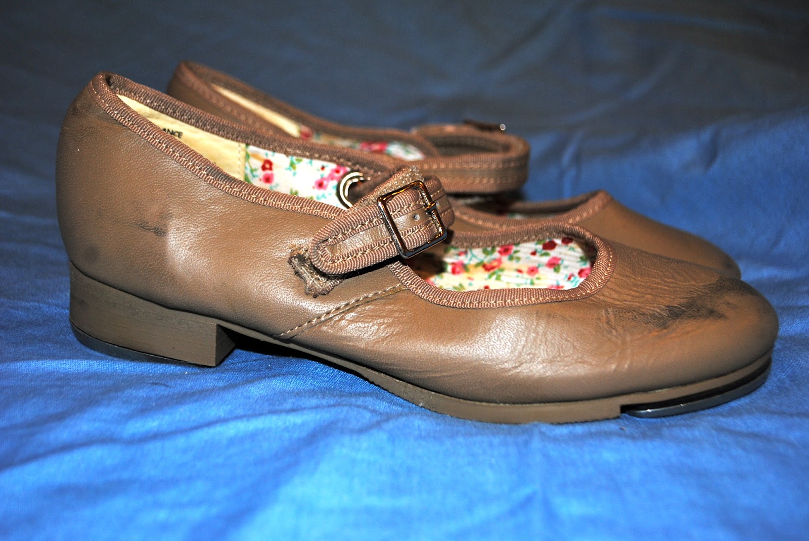 Let's Raise the Barre Capezio tan tap shoes, size 1