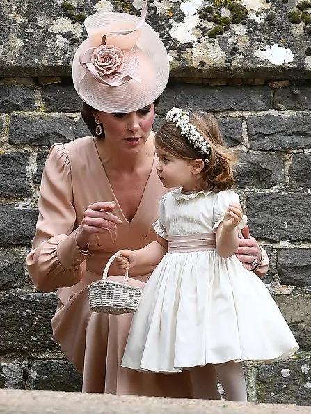 Duchess Catherine, her children Prince George of Cambridge, page boy and Princess Charlotte of Cambridge, flower girl attend the wedding of Pippa Middleton