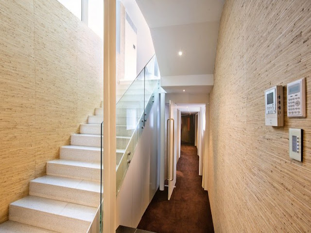 Narrow hallway with staircase