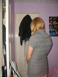 My scoliosis before scoliosis surgery in a jumper showing my rib hump