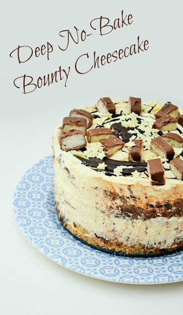 Deep No-Bake Bounty Coconut Cheesecake. An easy no bake cheesecake with a biscuity base, a thick layer of cheesecake filling flavoured with coconut and chocolate, topped with more melted chocolate, generous slices of Mars Bounty bar and white chocoalte sprinkles.
