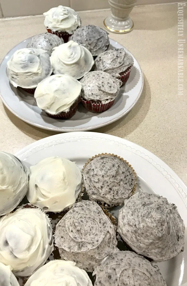 Oreo On The Bottom Cupcakes with oreo frosting and vanilla frosting on plates