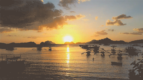 GIF showing the time-lapse feature, with imagery of boats at sunset