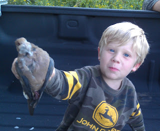 Son holding a dead dove