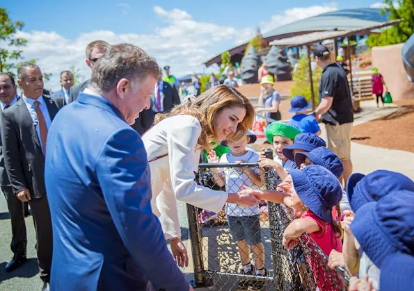 Queen Rania of Jordan visit the National Arboretum in Canberra, Queen wore Fendi blazer and fendi skirt, Prada handbags, Gianvito Rossi metalic gold pumps