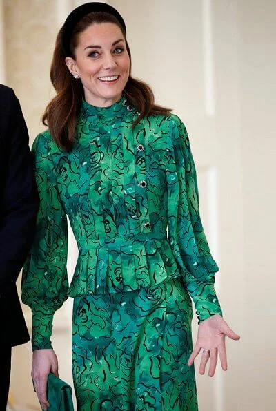 Kate Middleton wore a new silk peplum dress by Alessandra Rich, and Catherine Walker coat. Michael Higgins and Sabina Coyne