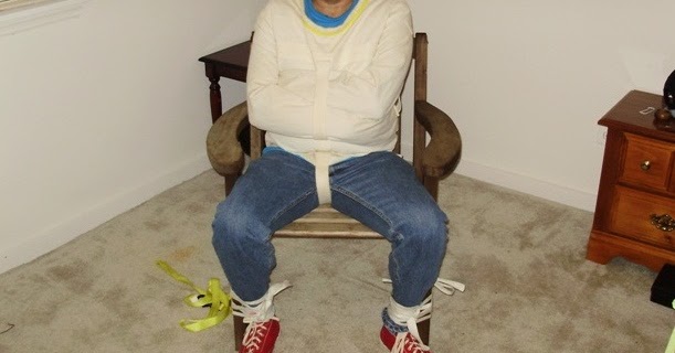 Asicswrestone Strapped To A Chair In A Straight Jacket Hooded And Gagged