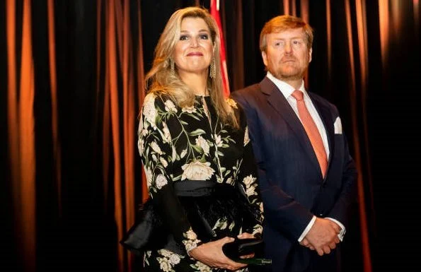 Queen Maxima wore a floral print silk dress by Johanna Ortiz, and she wore Gianvito Rossi sandals, diamond earrings