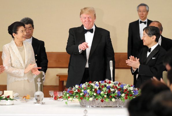 Empress Masako and first lady Melania Trump both wore light dresses. Crown Prince Fumihito, Crown Princess Kiko