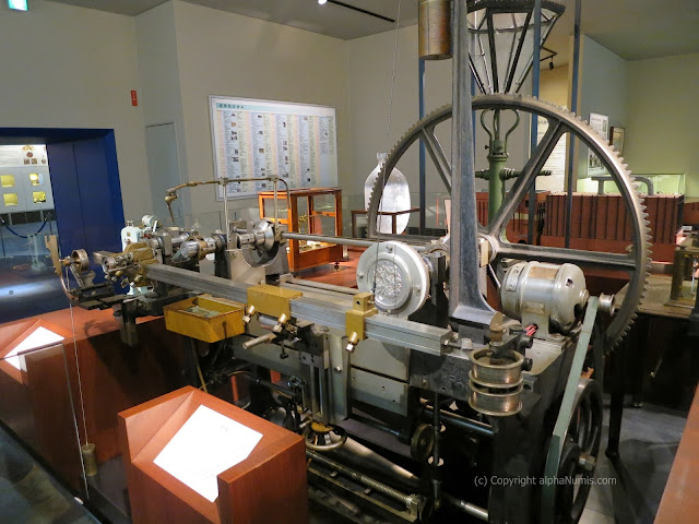 The transfer reduction lathe or Javier machine which reduces the 8 to 10 inch design on to a Master Hub of the coin at 26.5mm in diameter The transfer reduction lathe or Javier machine which reduces the 8 to 10 inch design on to a Master Hub of the coin at 26.5mm in diameter