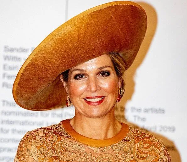 Queen Maxima wore Claes Iversen lace midi dress. Minister Ingrid van Engelshoven presented the award to Rory Pilgrim