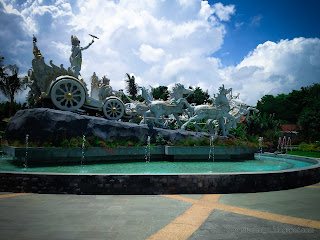 Beautiful Garden Pond Of Krishna's Chariot Statue At The Front Of The Park At Tangguwisia Village, North Bali, Indonesia