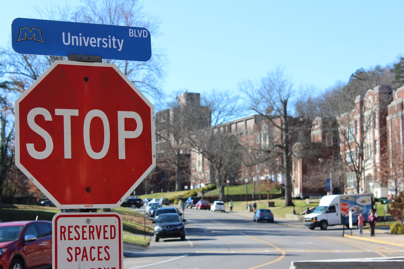 Much More Progress Road signs changing on campus