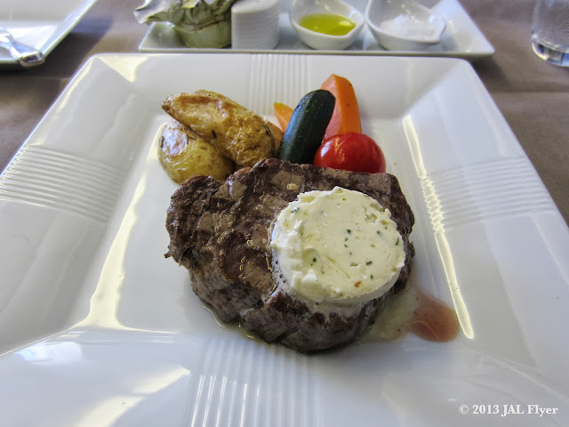 JAL First Class trip report on JL005: Main Dish - Grilled Fillet of US Prime Beef with Roasted Garlic Sauce & Anchovy Butter 