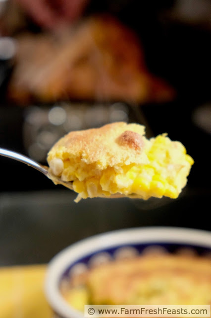 image of a spoonful of dairy free corn pudding casserole with roasted corn and caramelized onions