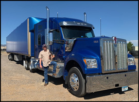 Larry Martin stands with his 2019 Kenworth W990
