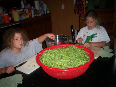 Girls helping with green beans.