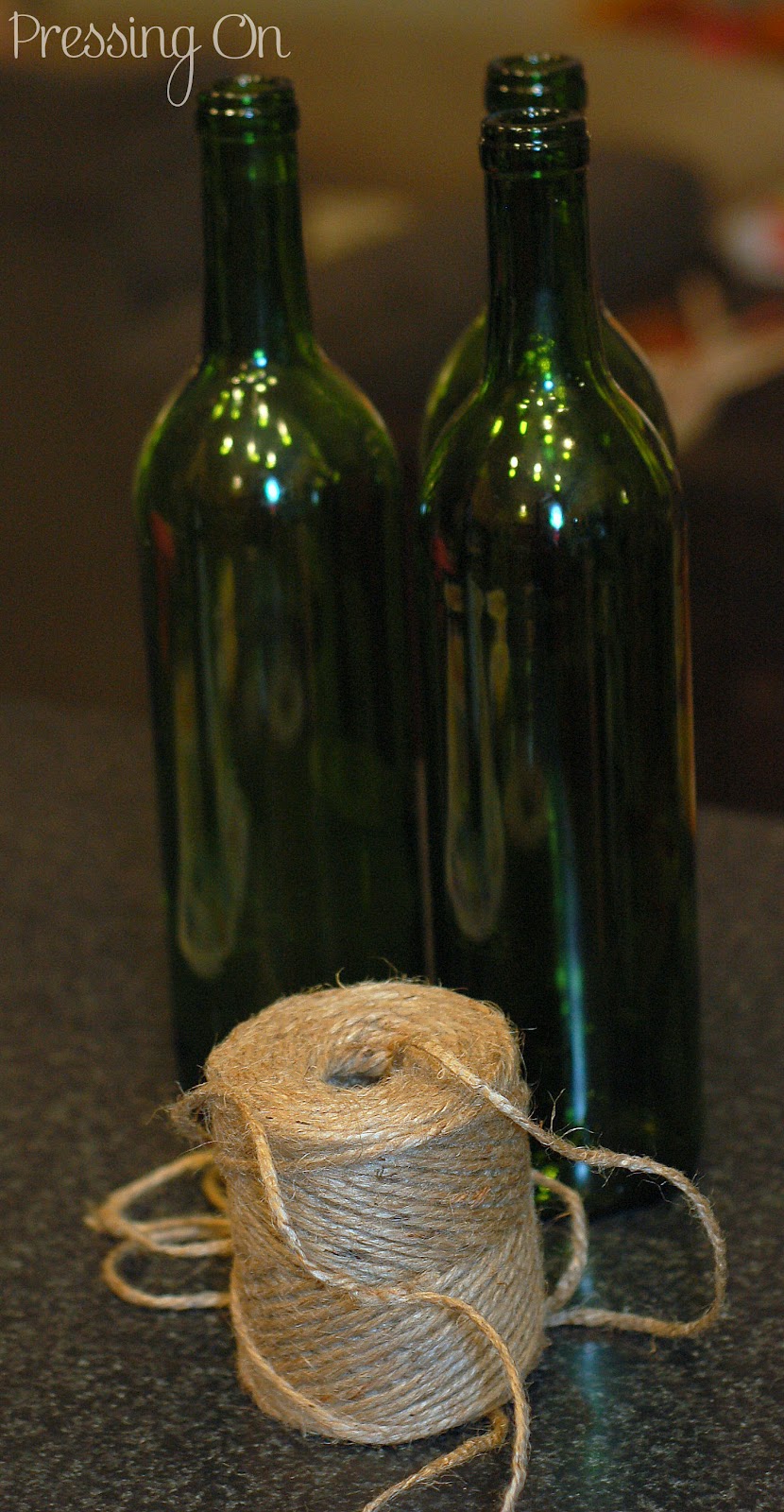 Pressing On Jute Wrapped Wine Bottles