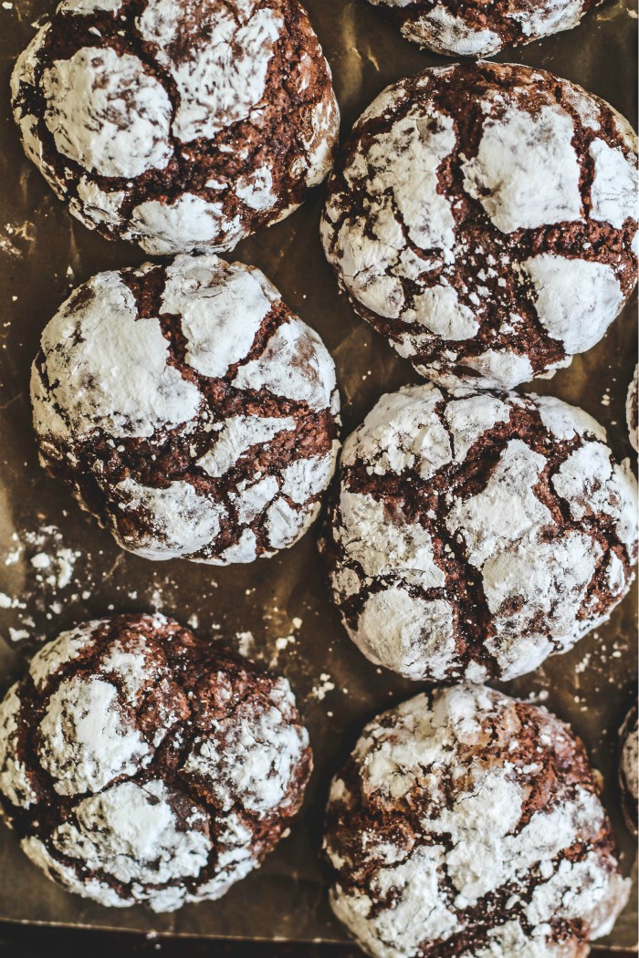 Chocolate Crackle Cookies One of our most loved Christmas cookies. Chocolate Crackle Cookies have a brownie like center and a soft crisp outside. Add these delightful cookies to your Christmas cookie tray! #baking #cookies #christmascookies #dessert #chocolate