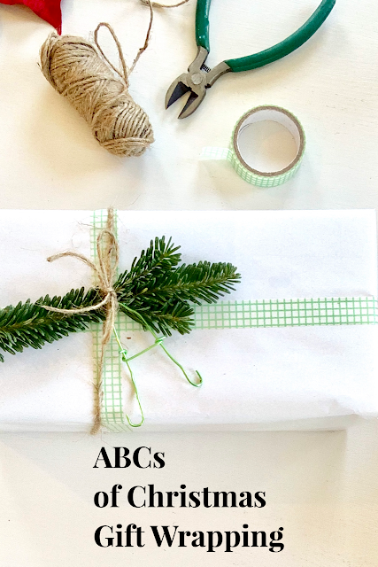 Christmas Gift Wrapping with wrapped present and tools for wrapping
