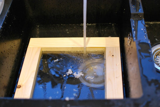 frame in sink with water running