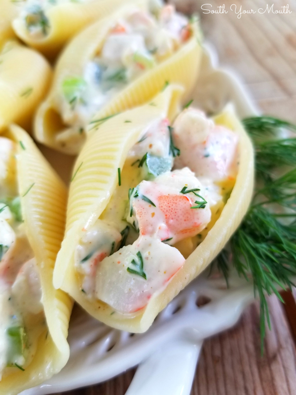 Seafood Salad Stuffed Shells | Individual seafood pasta salad servings made with jumbo pasta shells filled with an easy homemade recipe for seafood salad perfect for entertaining and lunch on the go!