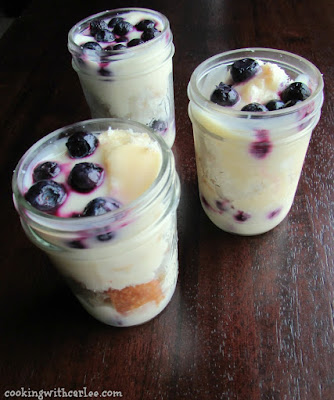 These gems are perfect for spring. Make as one big trifle or as individual trifles. Lemon. blueberries and angel food are a match made in heaven! Perfect for Easter and spring! jars of lemon and blueberry parfaits