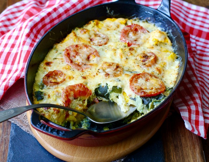This Zucchini Tomato Gratin is one of my favorite summer dishes. It is really easy to make, and is a great way to use up all of your summer squash bounty. This Zucchini Tomato Gratin is one of my favorite summer dishes. It is really easy to make, and is a great way to use up all of your summer squash bounty.