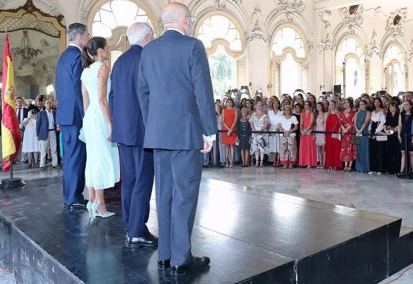 Queen Letizia wore Adolfo Dominguez embroidered cotton dress with belt. Letizia wore a new aquamarine blue midi dress