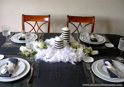 decoracion mesas blanco y negro con plumas