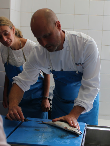 Our chef, Sean, showing us how to cut open the chamber of the fish Our chef, Sean, showing us how to cut open the chamber of the fish