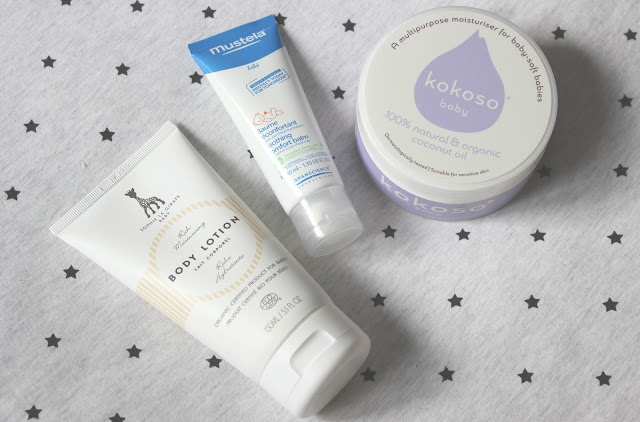 Sophie La Girafe Baby Body Lotion, Mustela Soothing Comfort Balm and Kokoso Baby Coconut Oil A picture of Sophie La Girafe Baby Body Lotion, Mustela Soothing Comfort Balm and Kokoso Baby Coconut Oil