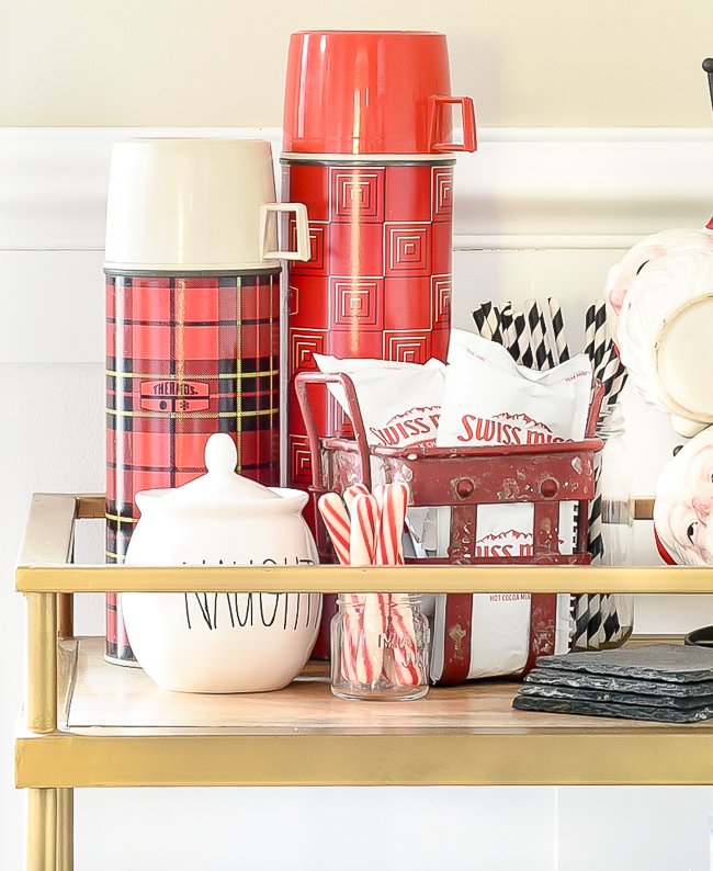 Peppermint sticks and vintage thermoses for the perfect hot cocoa bar
