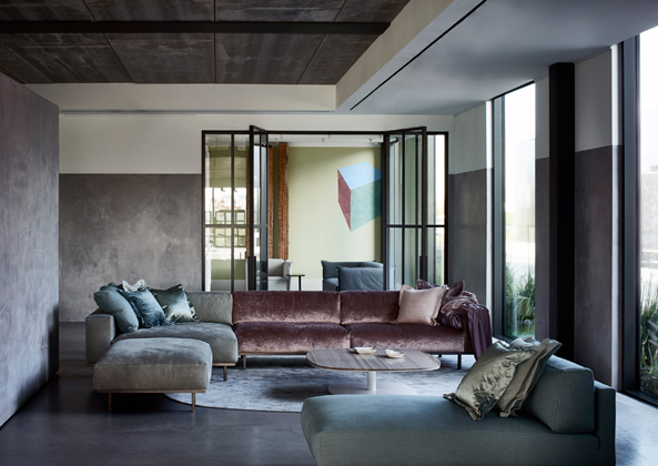 Modern luxury sectional in living room minimal sophisticated interior design by Piet Boon 