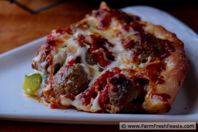 A pizza you can really sink your teeth into--this is filled with meatballs and vegetables sandwiched between two layers of cheese in a hearty deep dish pizza.
